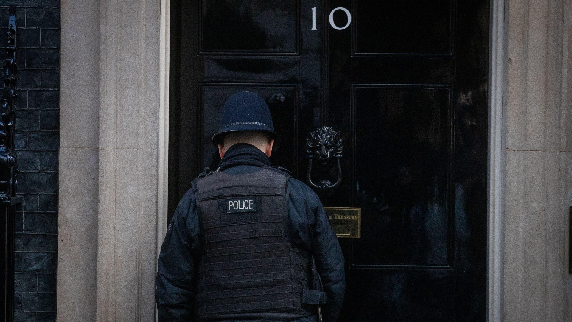 A police officer at the door of No. 10 Downing Street