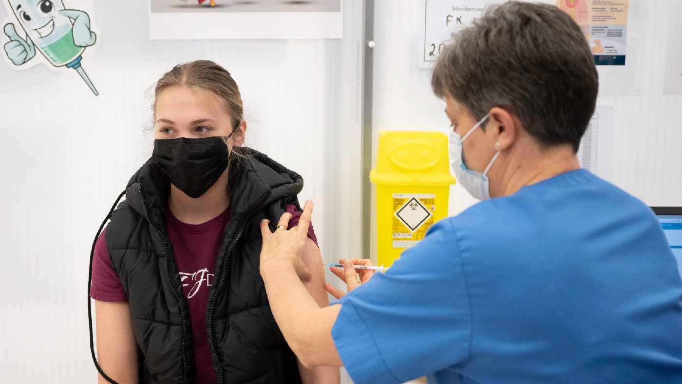 A teenager being vaccinated