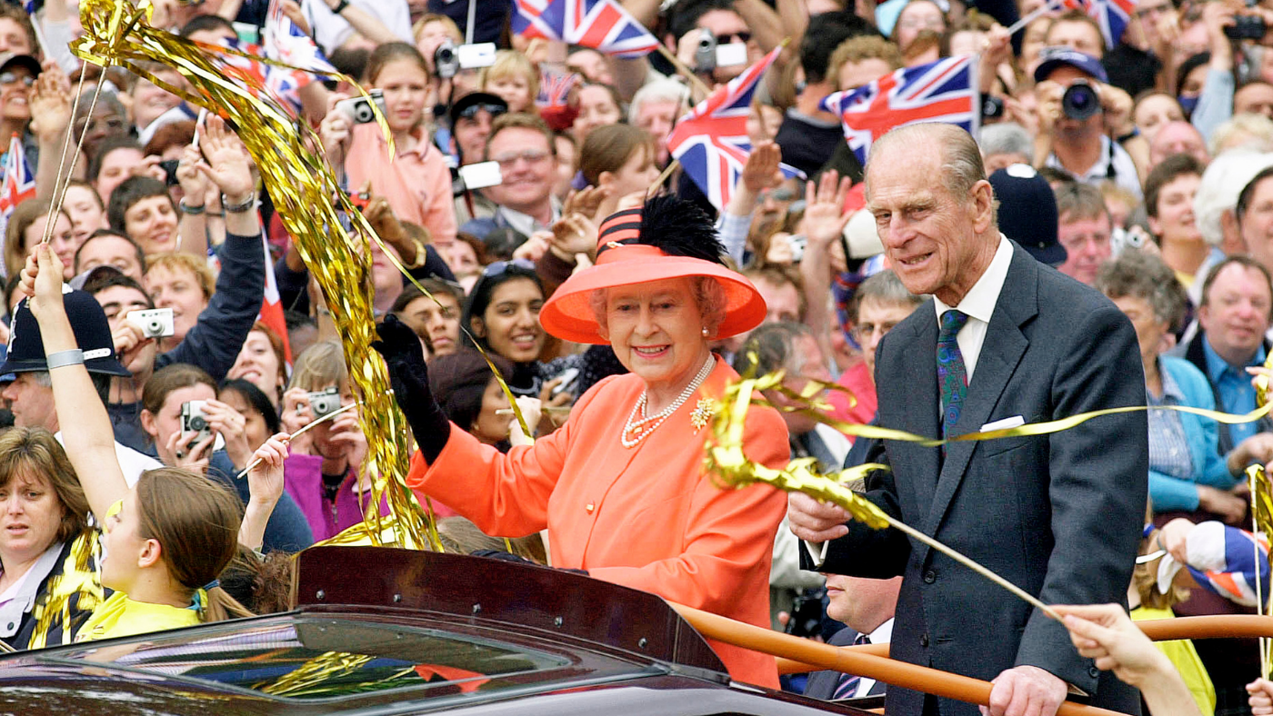 Queen and Prince Philip in a procession on the Mall in 2002