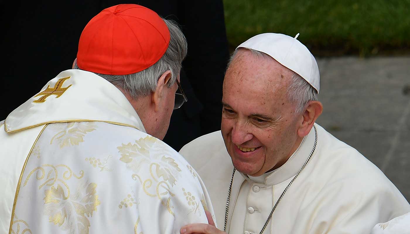 Pope Francis greets Cardinal George Pell at the Vatican