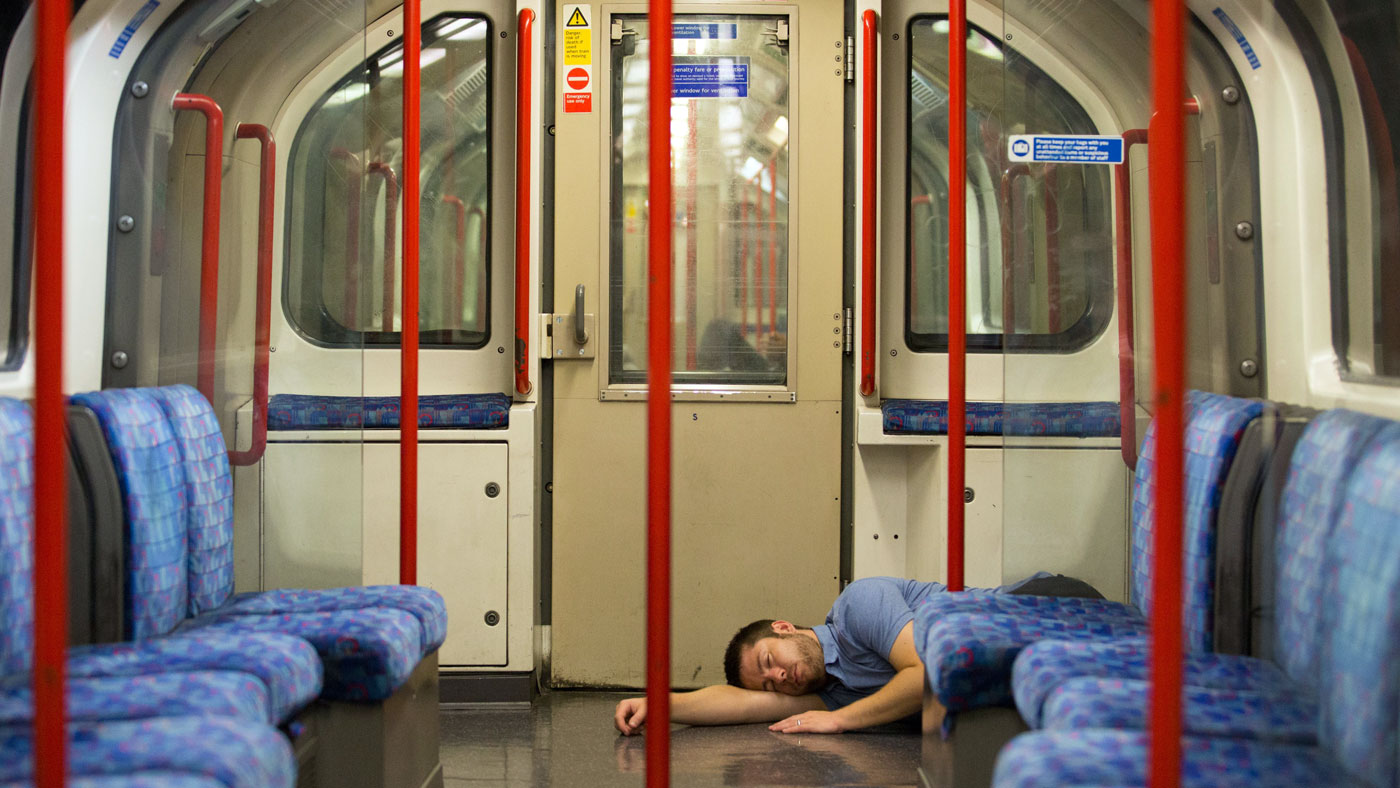 A reveller takes a nap on the first night of London&#039;s Underground 24-hour service