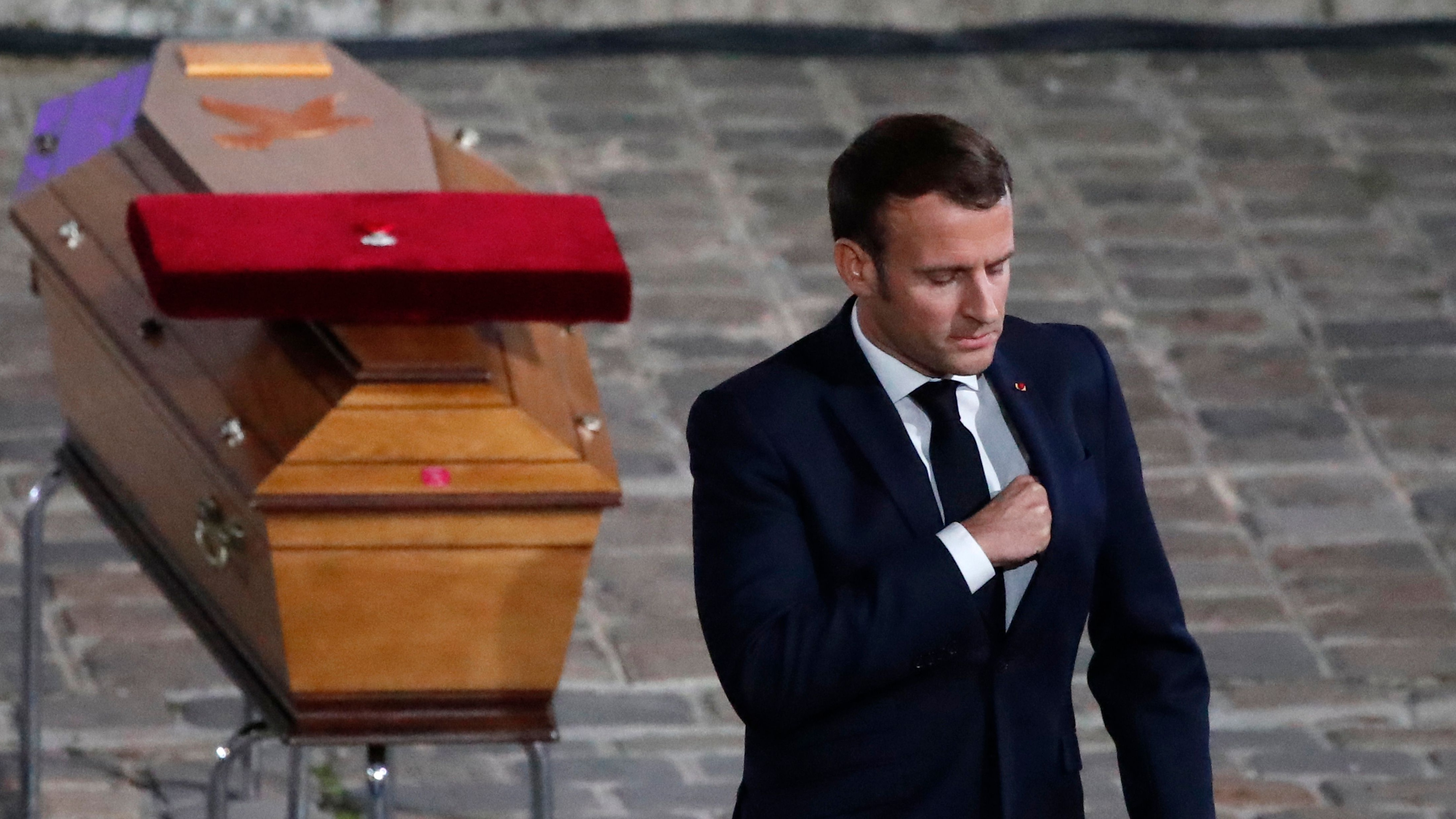 Emmanuel Macron pays his respects by the coffin of Samuel Paty&#039;s inside Sorbonne University&#039;s, Paris.