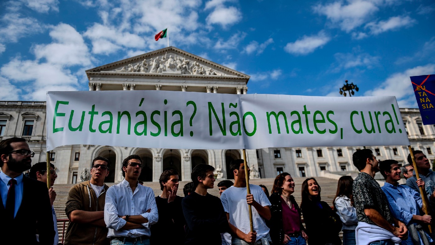 Protestors hold a banner reading ‘Euthanasia? Don&#039;t kill, cure!’ during a demonstration against the decriminalisation of euthanasia 
