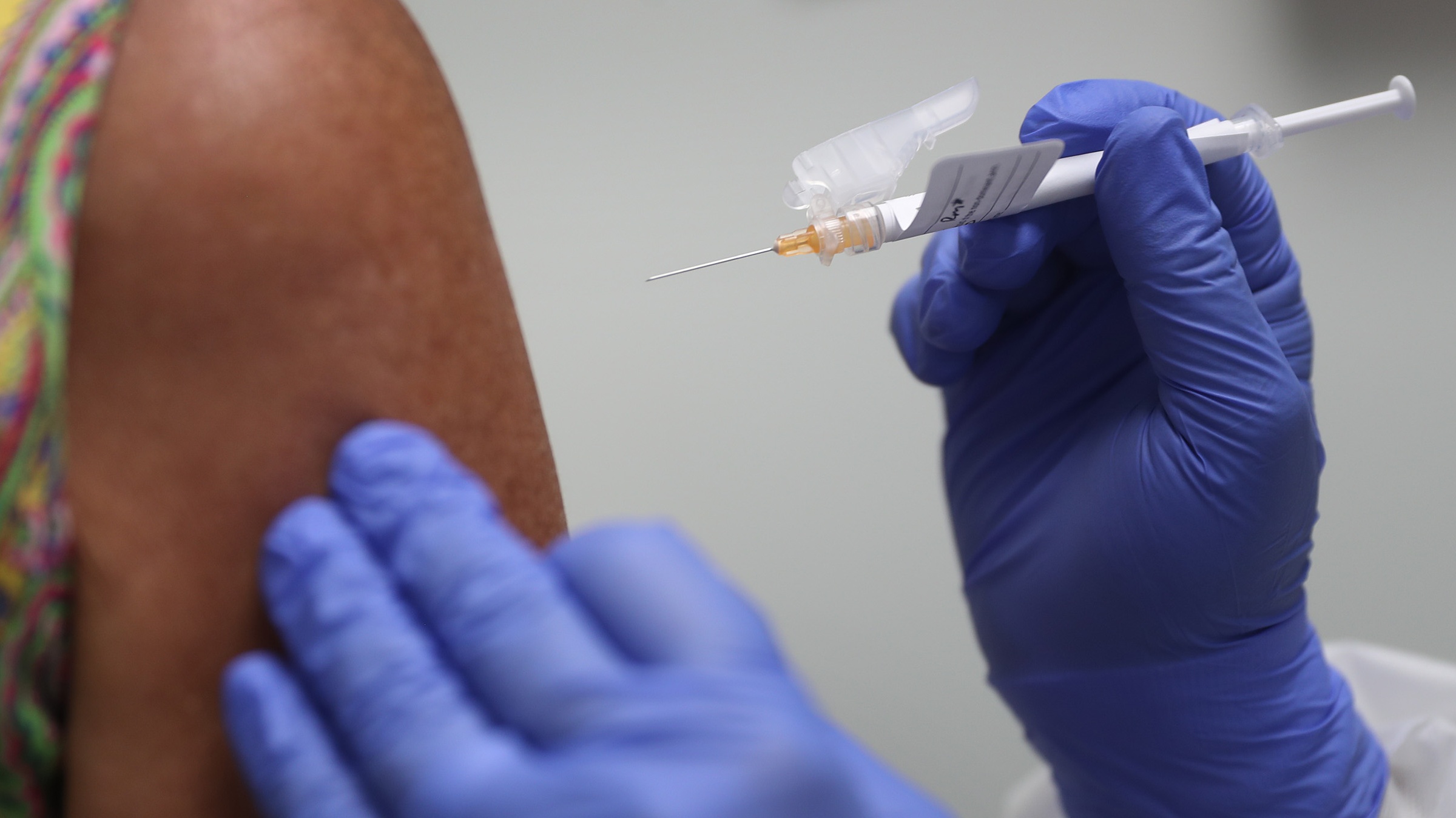 Woman receives an injection of a Covid vaccine during a clinical trial.