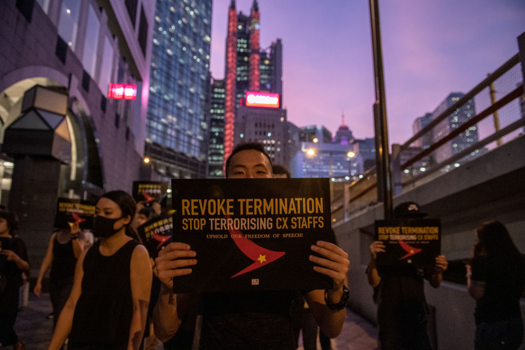 A Protester is seen holding up a placard during a rally in Hong Kong on August 28, 2019. Protester gather in Central in Protest of Cathay Pacific&#039;s dismissal of numbers of employee allegedly 