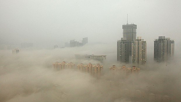 LIANYUNGANG, CHINA - DECEMBER 08:(CHINA OUT) Buildings are shrouded in smog on December 8, 2013 in Lianyungang, China. Heavy smog has been lingering in northern and eastern parts of China sin