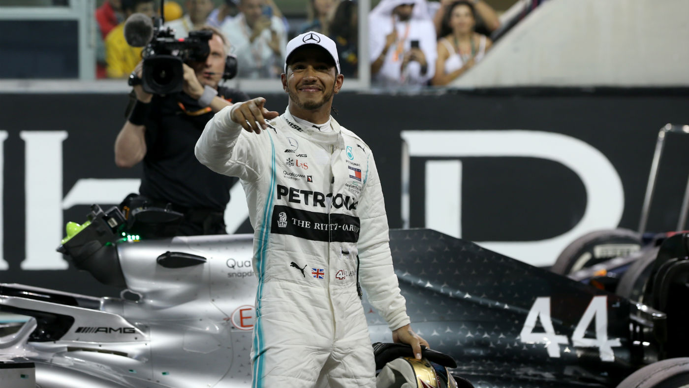 Mercedes driver Lewis Hamilton celebrates winning the 2019 F1 Abu Dhabi Grand Prix 