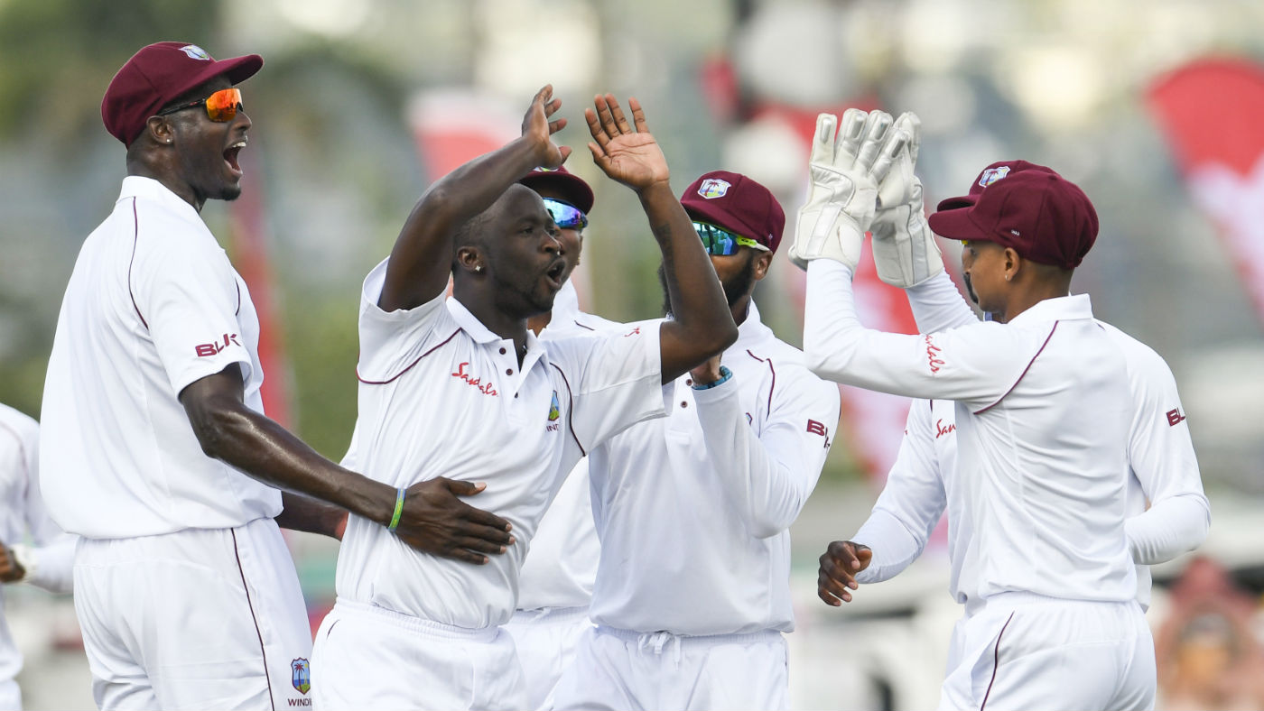 West Indies bowler Kemar Roach (second left) finished with figures of 5-17