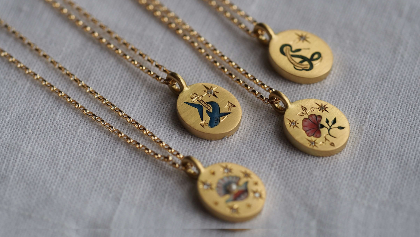 Some of Cece's 18k gold pendants with enamel design and diamonds, £1950