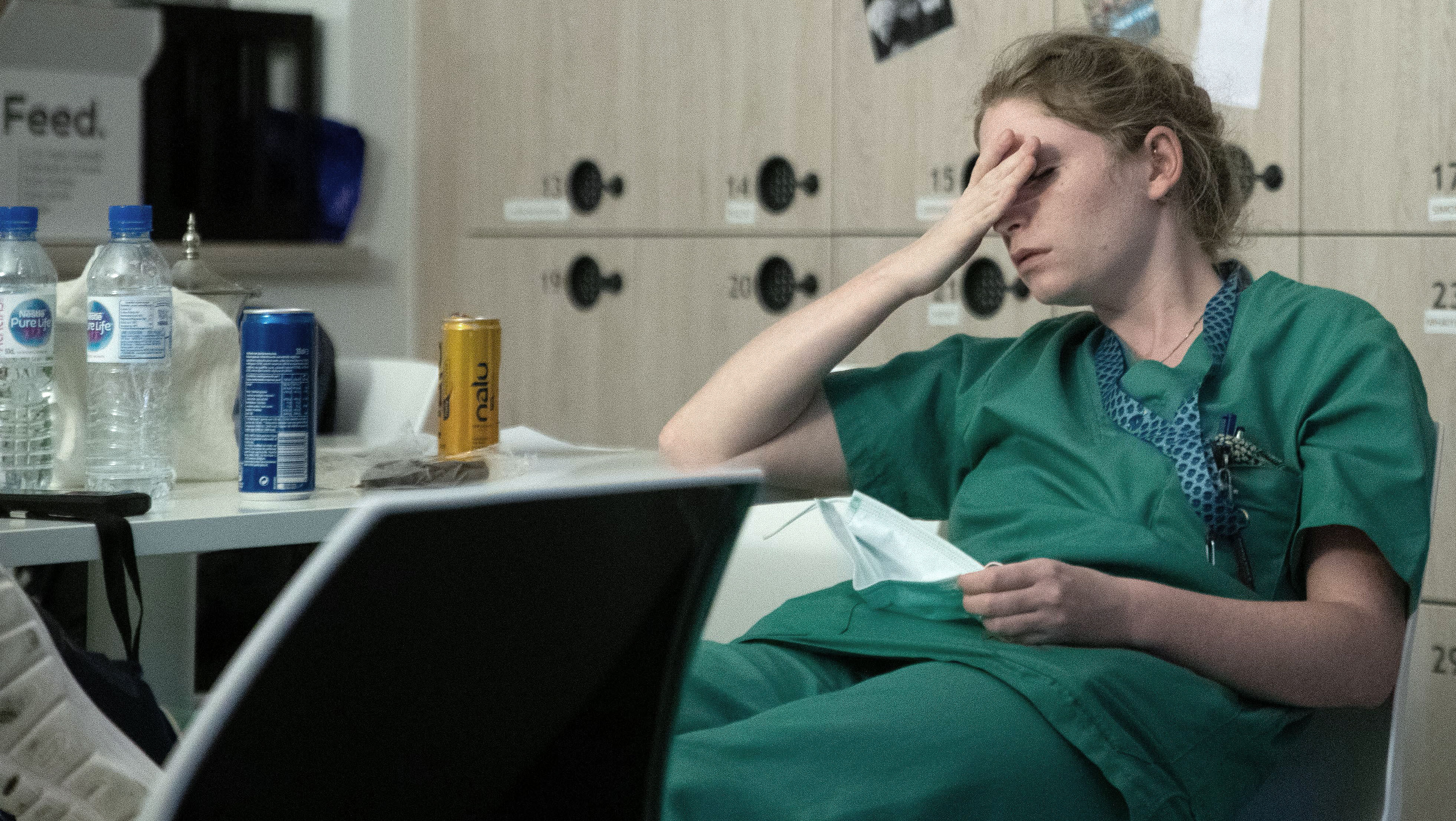 A nurse suffering from fatigue while treating coronavirus patients