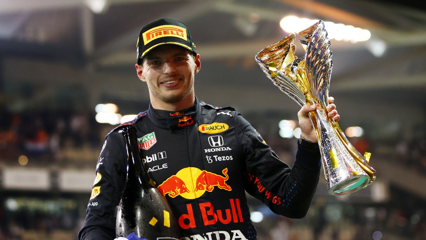 Max Verstappen celebrates on the podium in Abu Dhabi   