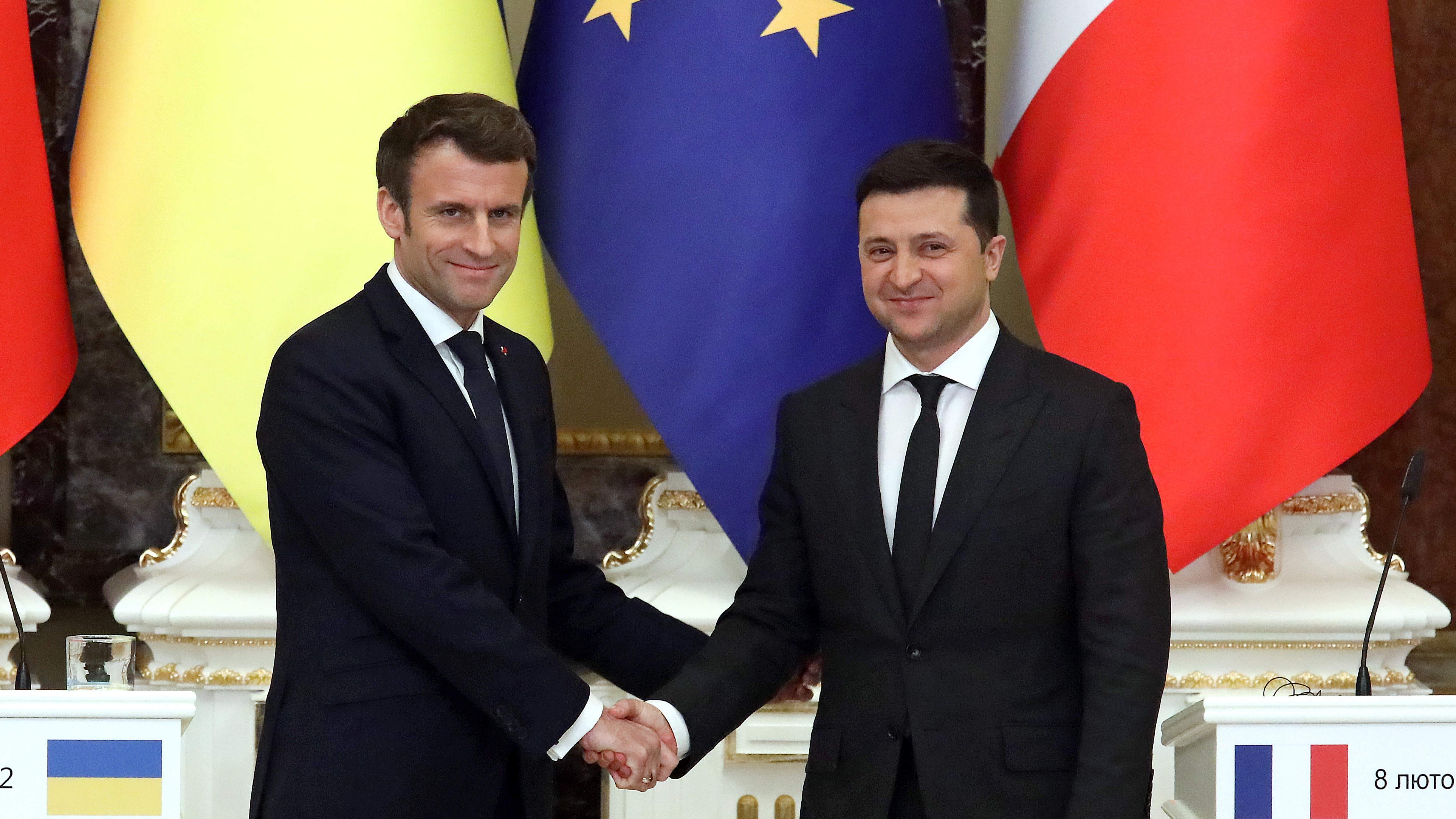 Emmanuel Macron shakes hands with Ukrainian President Volodymyr Zelensky in Kiev