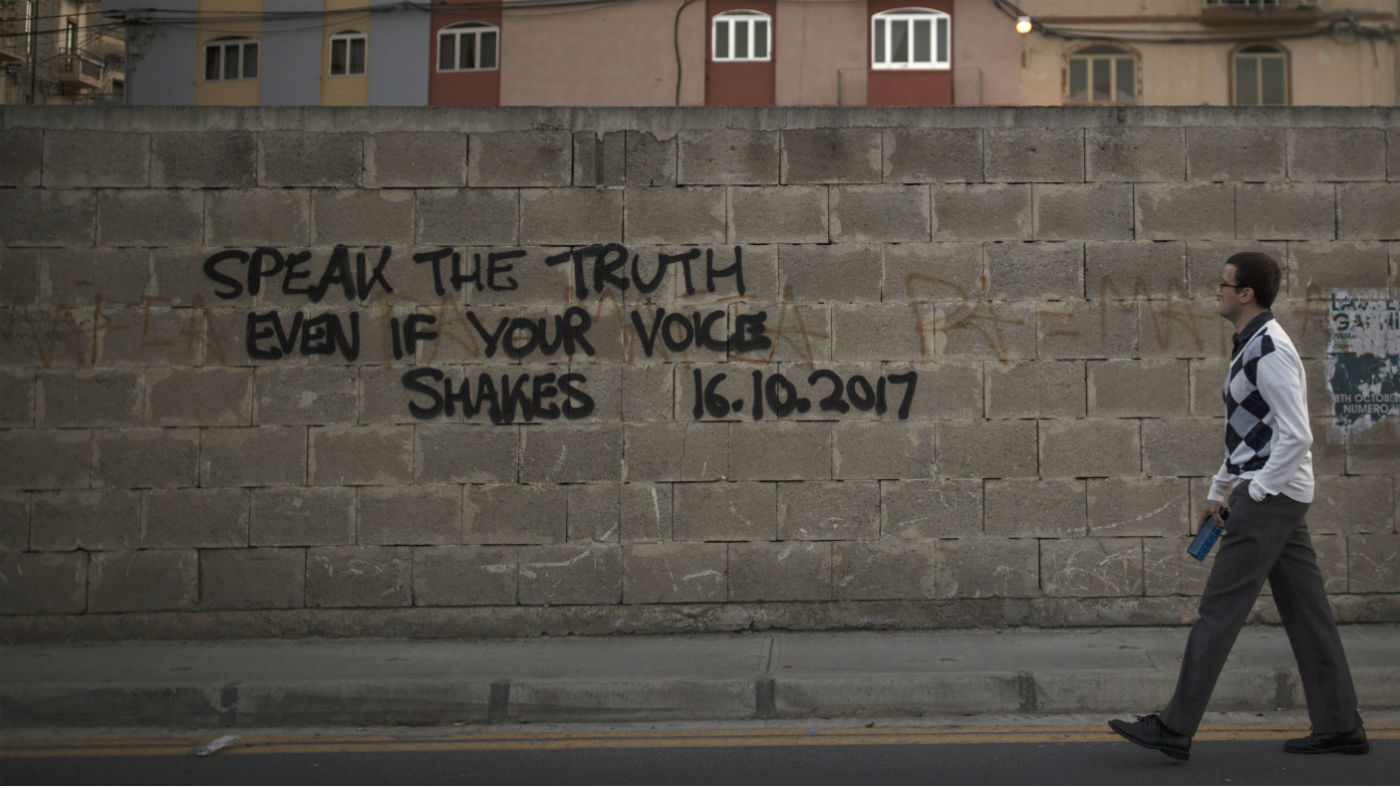 A tribute for the murdered journalist Daphne Caruana Galizia is sprayed on a wall in Valletta, Malta