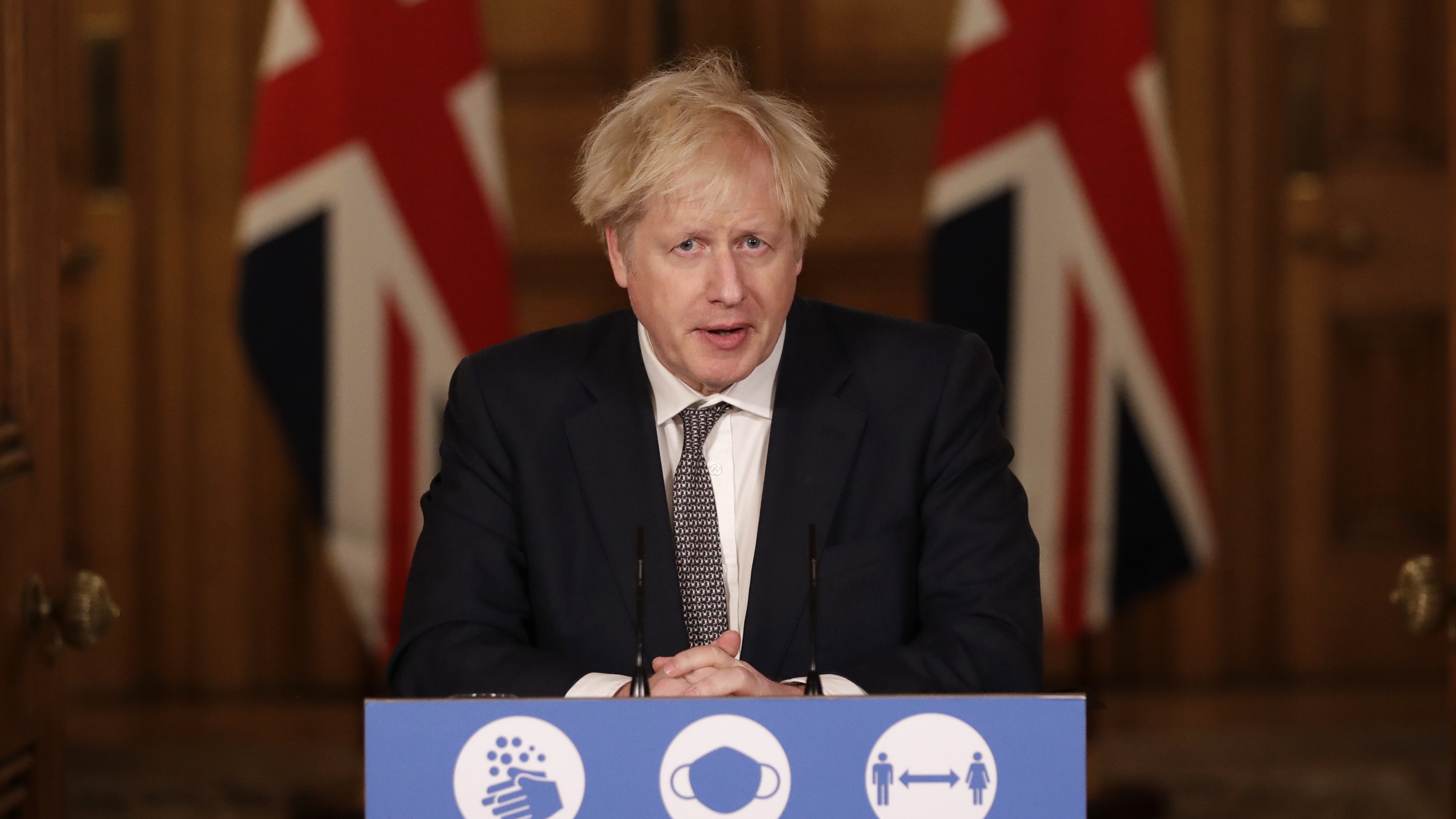 Boris Johnson speaks during a news conference at Downing Street.