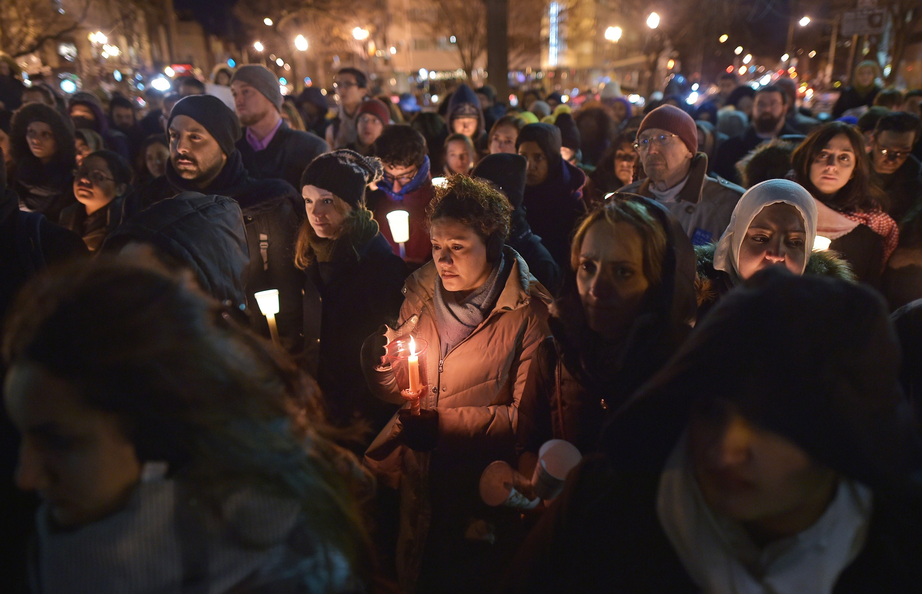 People take part in a vigil for three young Muslims killed in Chapel Hill, North Carolina, at Dupont Circle on February 12, 2015 in Washington, DC. The three were killed by a neighbour in wha