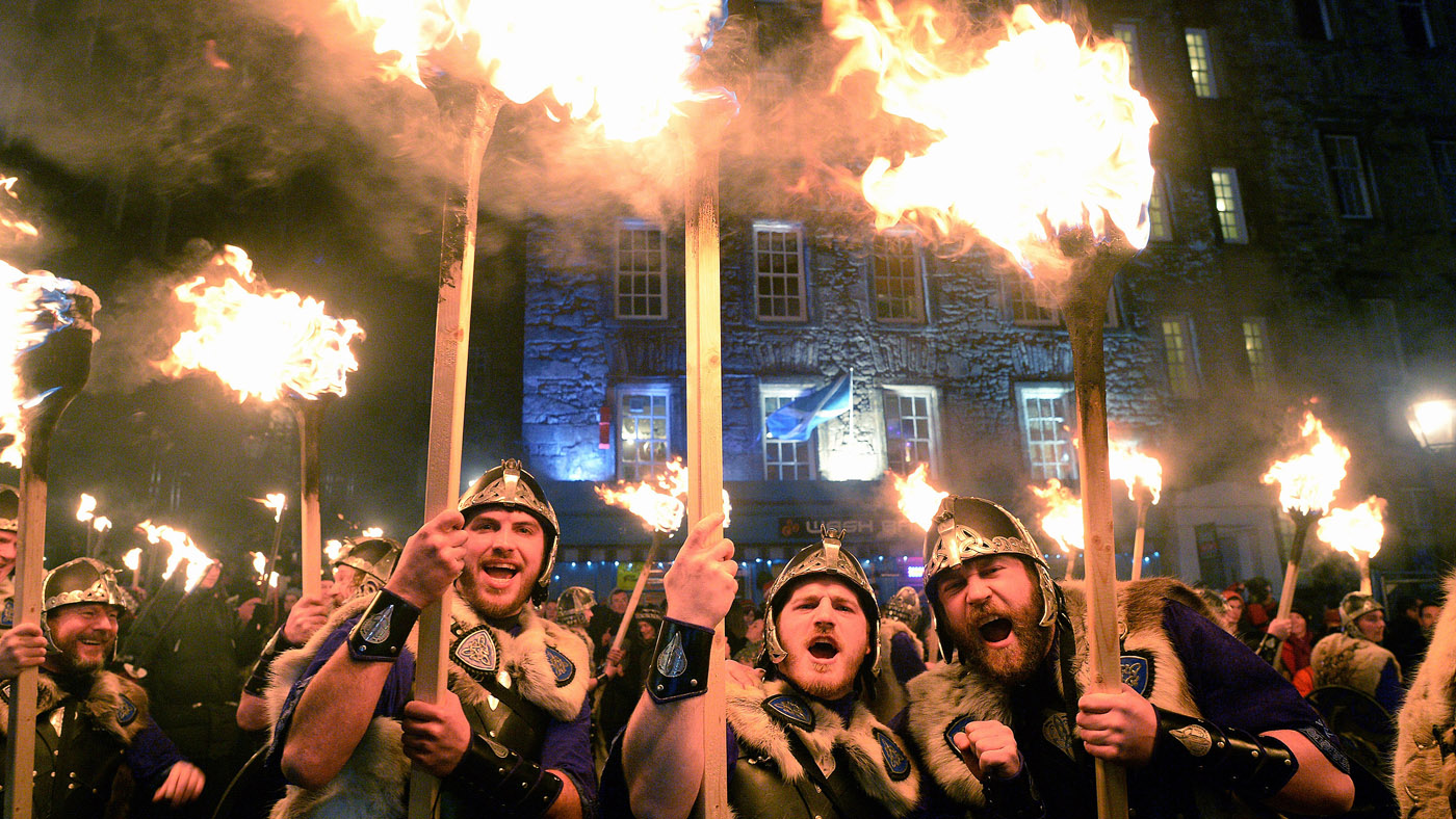 EDINBURGH, SCOTLAND - DECEMBER 30:Men dressed as Vikings take part in the torchlight procession as it makes its way through Edinburgh for the start of the Hogmanay celebrations on December 30