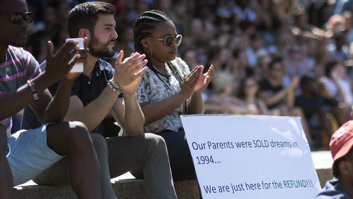 Students attend a meeting to discuss fee hikes, during ongoing protests at the university of Cape Town, on October 20, 2015, in Cape Town. This protest joins similar protests at other univers