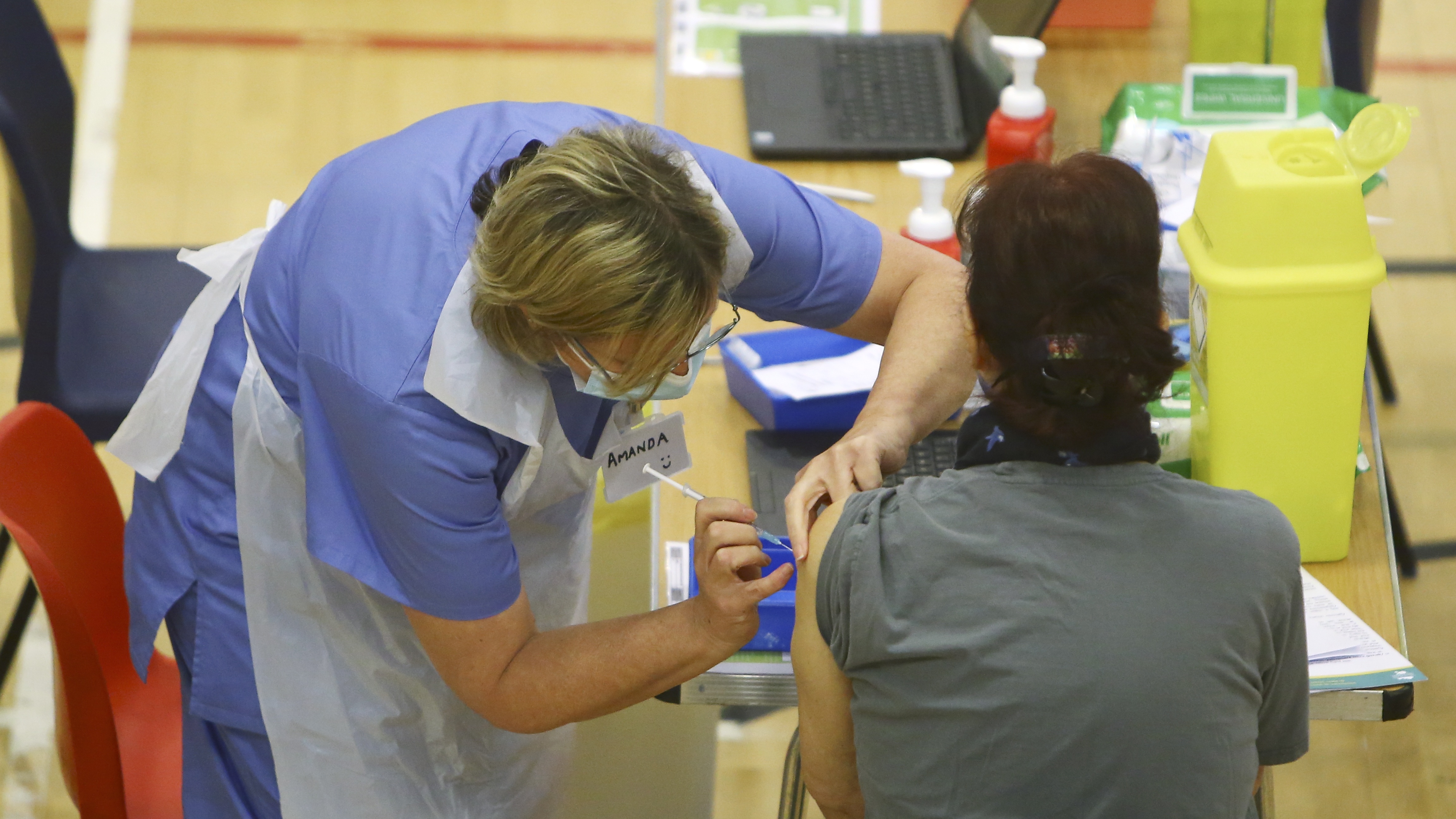 A patient in the UK receives the Oxford-AstraZeneca vaccine