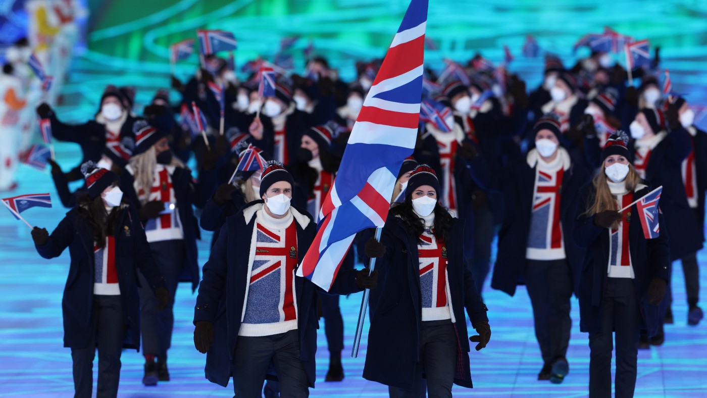 Flag bearers Dave Ryding and Eve Muirhead lead out Team GB   