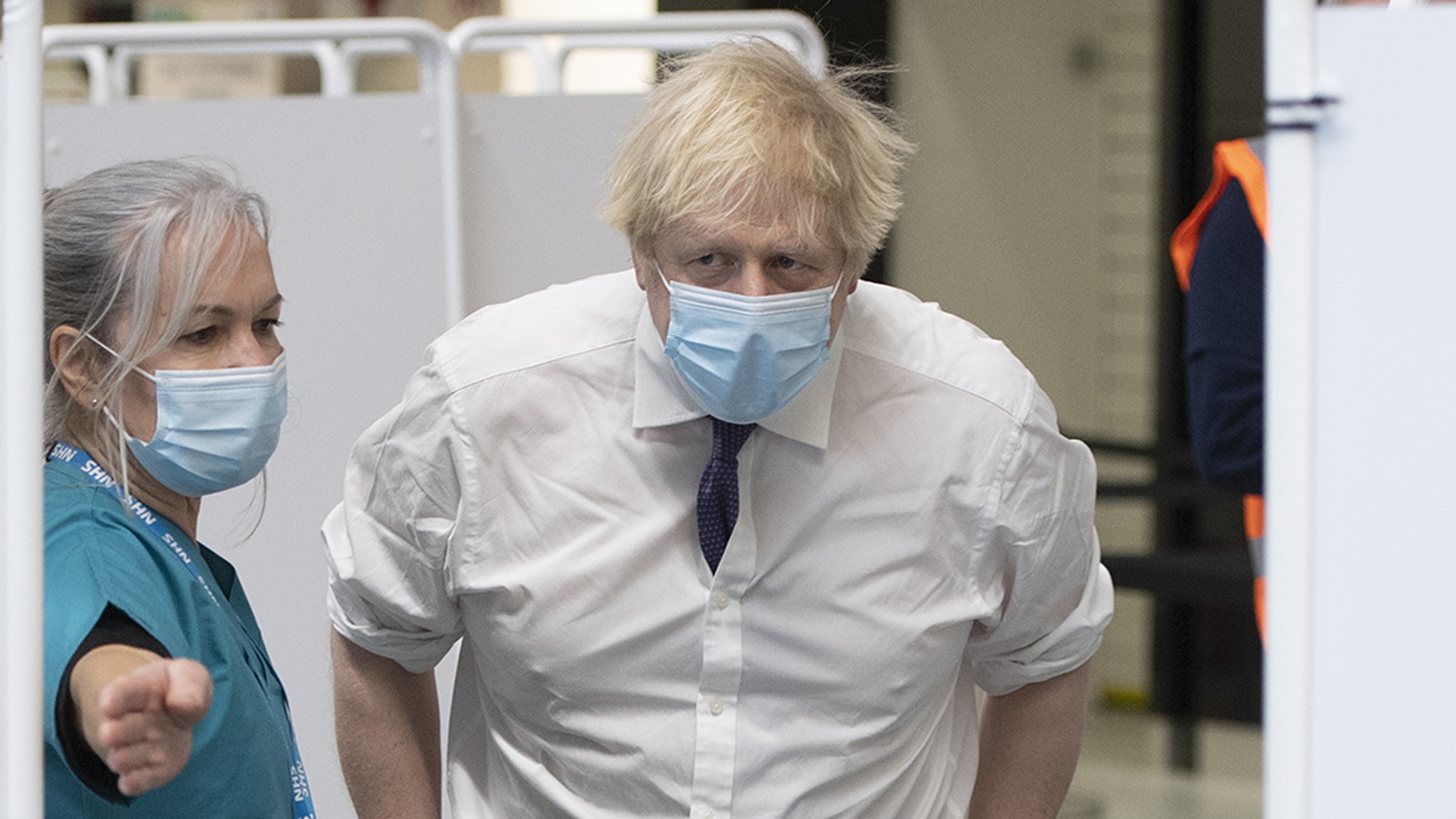 Boris Johnson visits a vaccination centre.