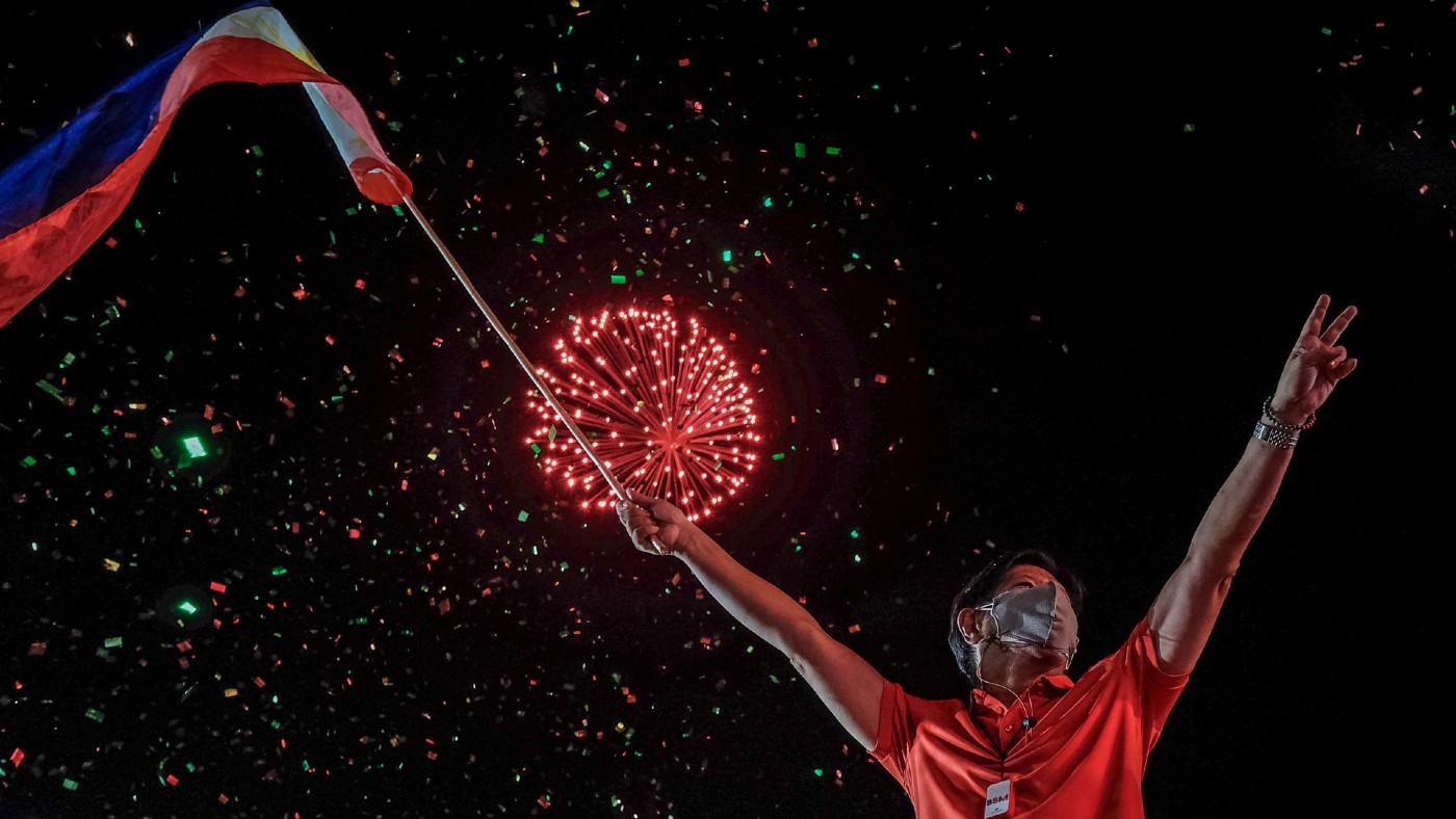 Ferdinand ‘Bongbong’ Marcos Jr with fireworks behind him