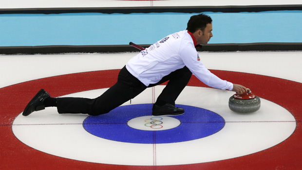 Britain&#039;s David Murdoch takes part in a training session at the Ice cube curling centre during the Sochi Winter Olympics on February 11, 2014.AFP PHOTO / ADRIAN DENNIS(Photo credit should rea