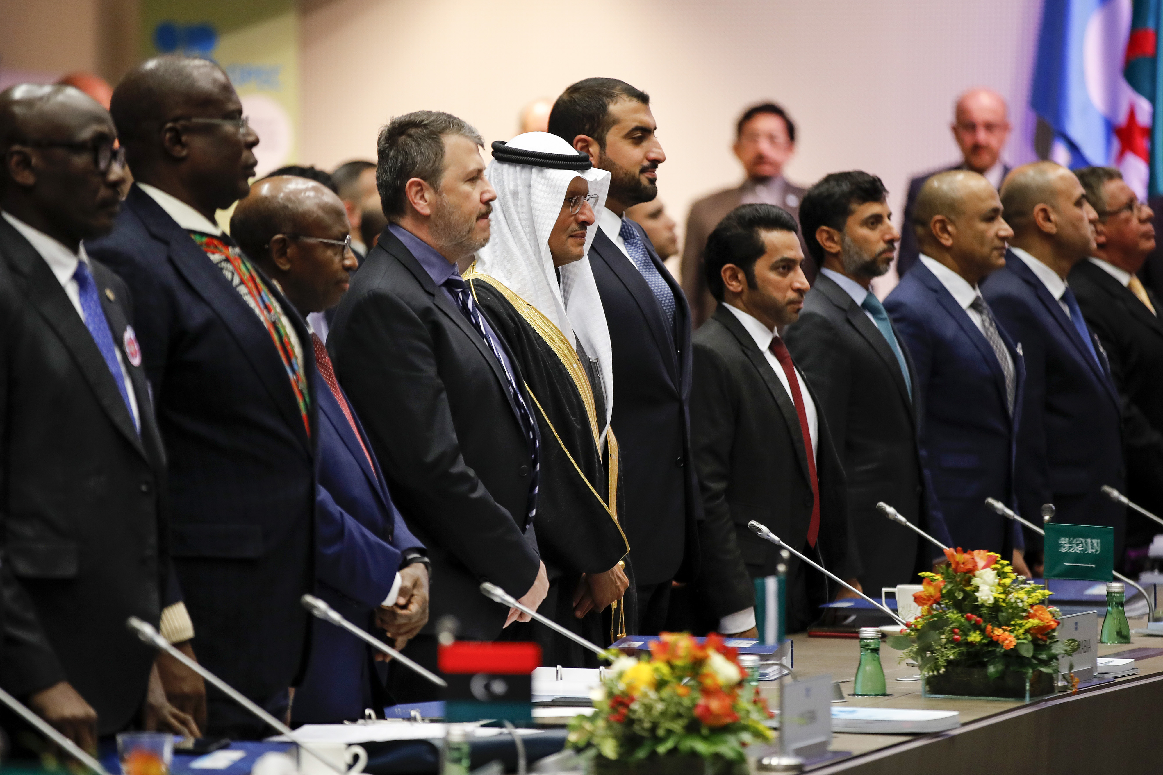 Abdulaziz bin Salman, Saudi Arabia&#039;s energy minister, fifth left, stands with other delegates for a minutes silence to pay tribute to the recently deceased Fadhil Chalabi, former acting secre