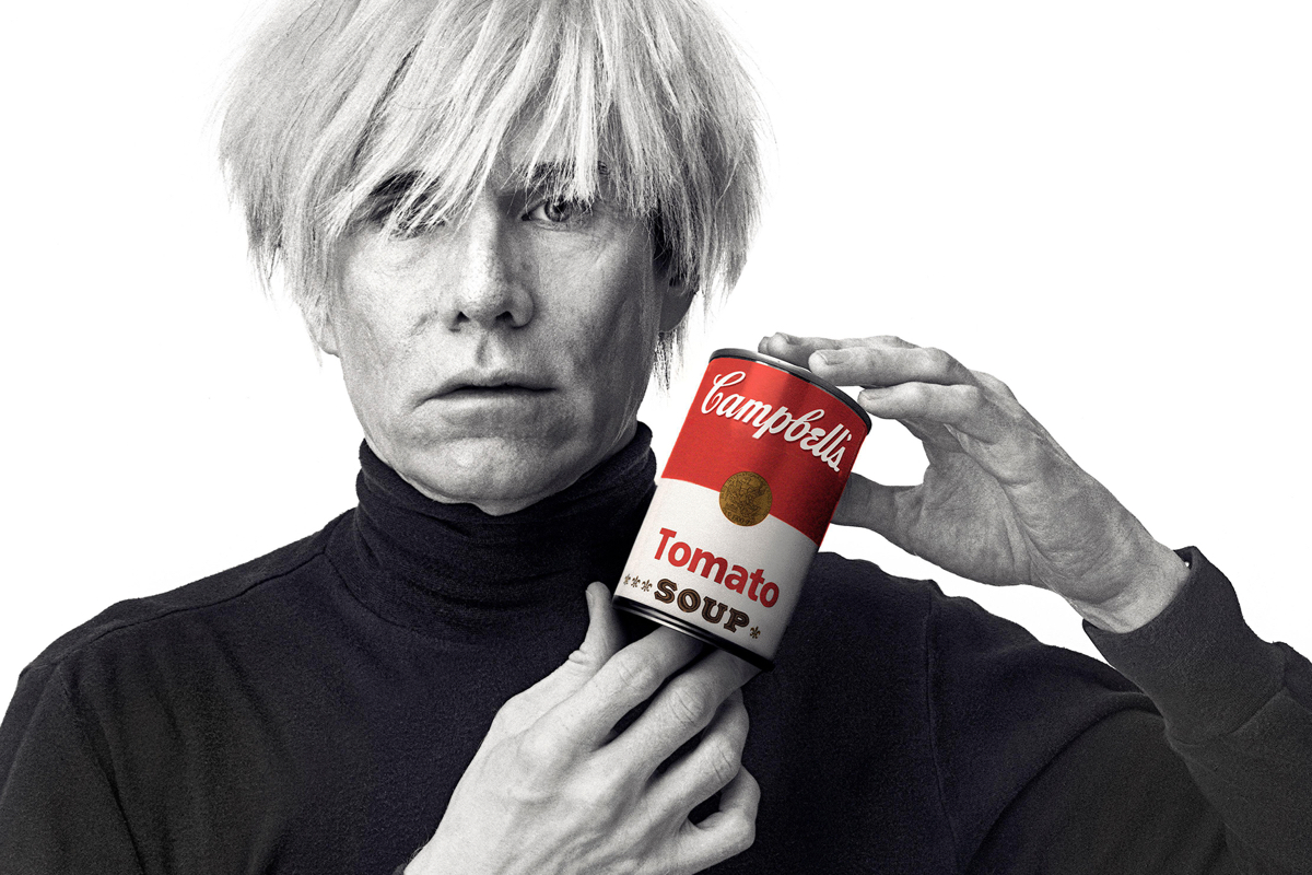Andy Warhol holding a Campbell&#039;s tomato soup can
