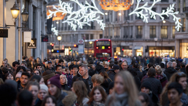 LONDON, ENGLAND - DECEMBER 14: Hordes of Christmas shoppers walk beneath festive lights on Regent Street on December 14, 2013 in London, England. As Christmas Day approaches, London&#039;s central