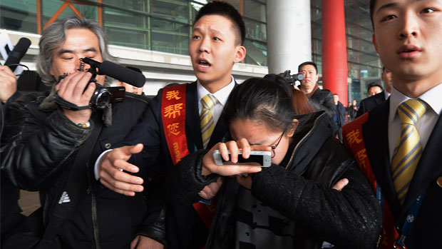 Relative of Malaysia Airlines passenger cries in Beijing