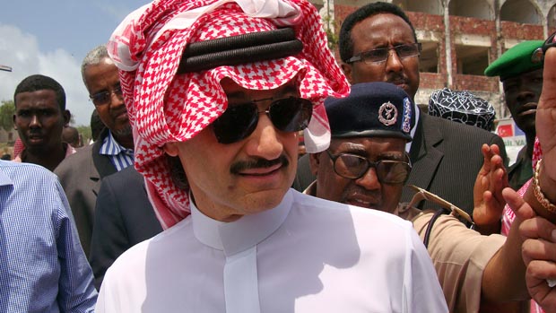 Prince Al-Waleed Bin Talal, nephew of the Saudi King, is guided on his visit to the Somalian capital, Mogadishu on August 27, 2011. A delegation from the Saudi royal family arrived today in M