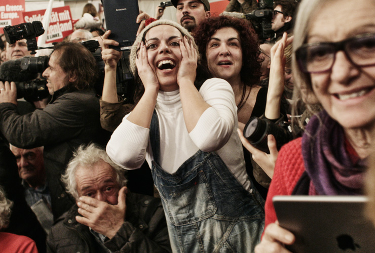 ATHENS, GREECE - JANUARY 25:Supporters of the opposition radical leftist Syriza party cheer at exit poll results which indicate that Syriza have a clear lead on January 25, 2015 in in Athens,