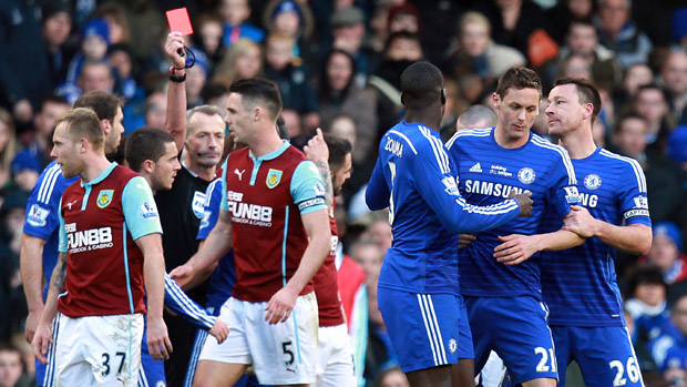 Chelsea&#039;s Serbian midfielder Nemanja Matic leaves the pitch after receiving a red card during the English Premier Lea