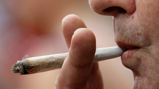  A man smokes licenced medicinal marijuana