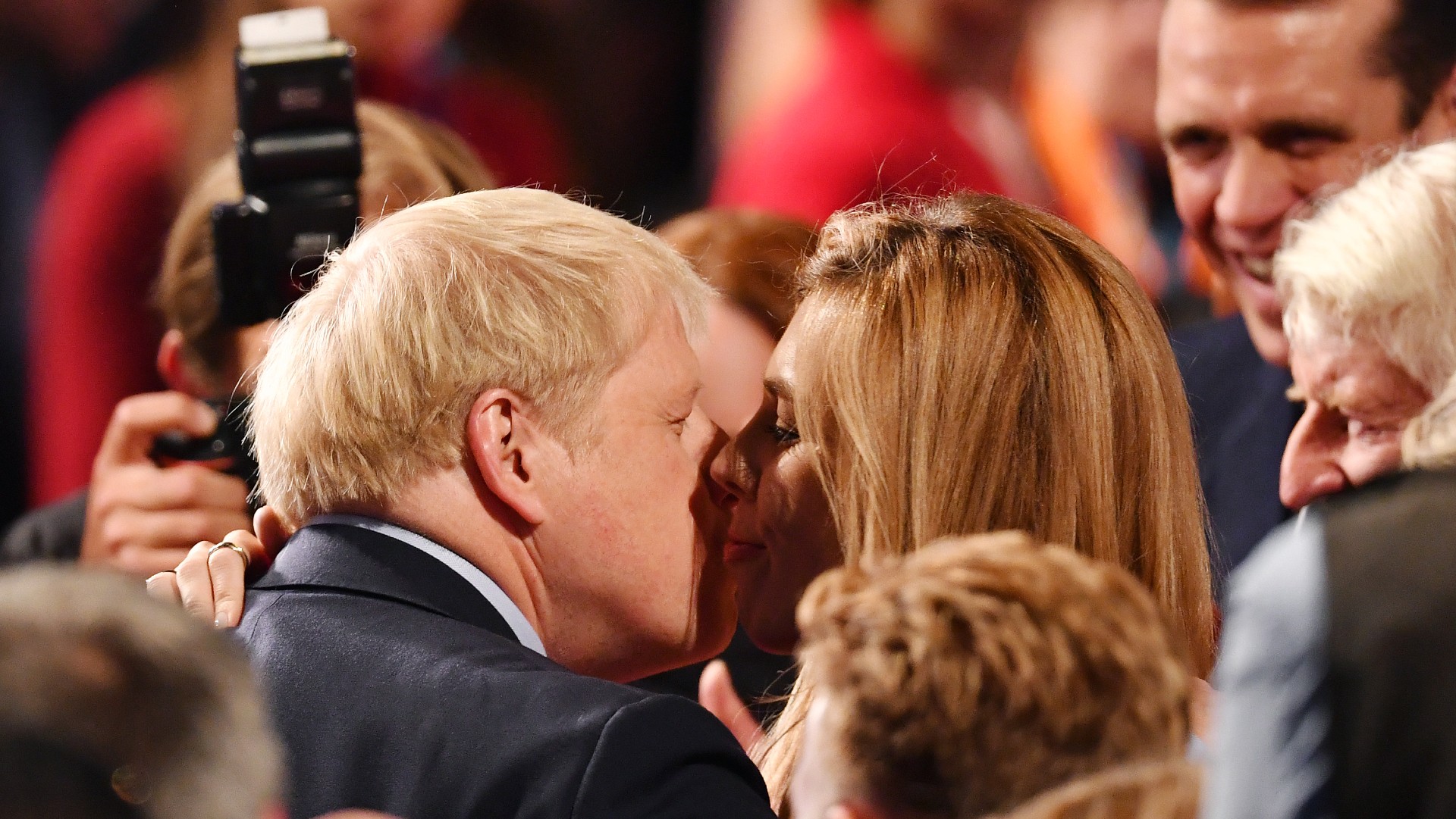 The prime minister kisses his then girlfriend Carrie Symonds