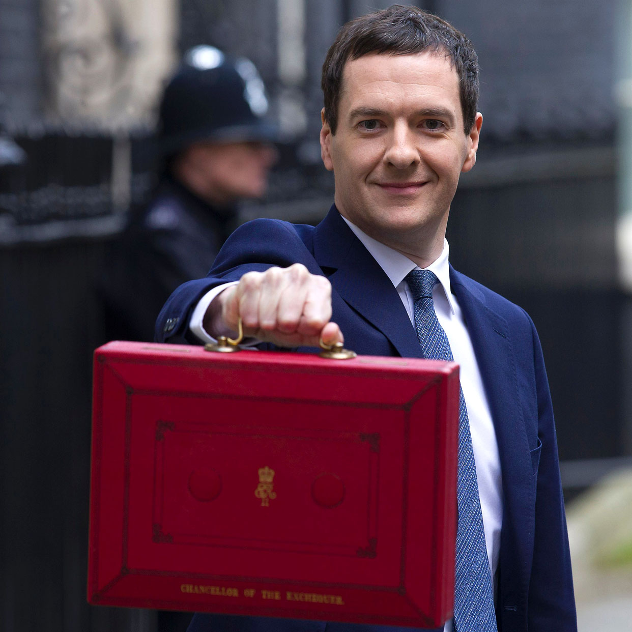 British Finance Minister George Osborne poses for pictures with the Budget Box as he leaves 11 Downing Street in London, on March 16, 2016, before presenting the government&#039;s annual budget to