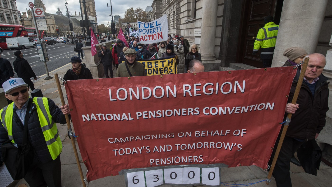 Protesters holding sign reading ‘National Pensioners Convention’