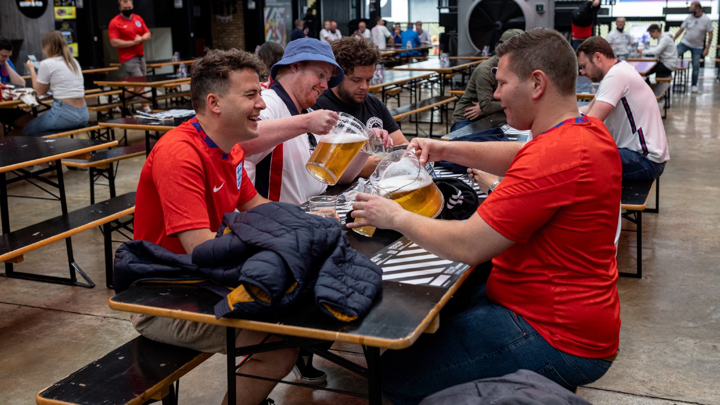 England fans pour pitchers of beer at Boxpark Wembley on Wednesday
