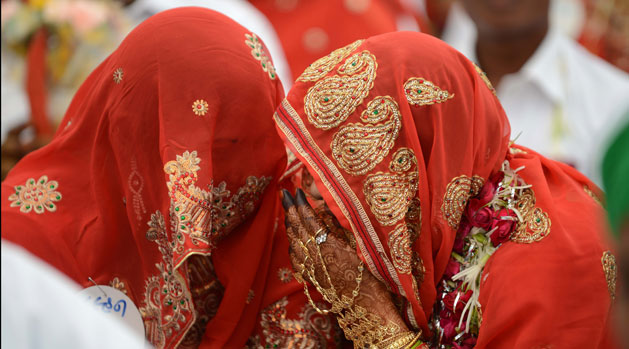 Brides at a mass wedding in India