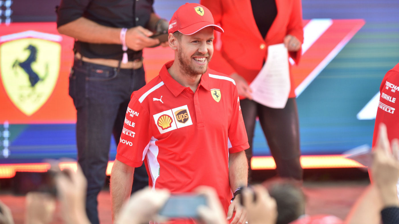 Ferrari driver Sebastian Vettel greets F1 fans at the season launch event in Melbourne