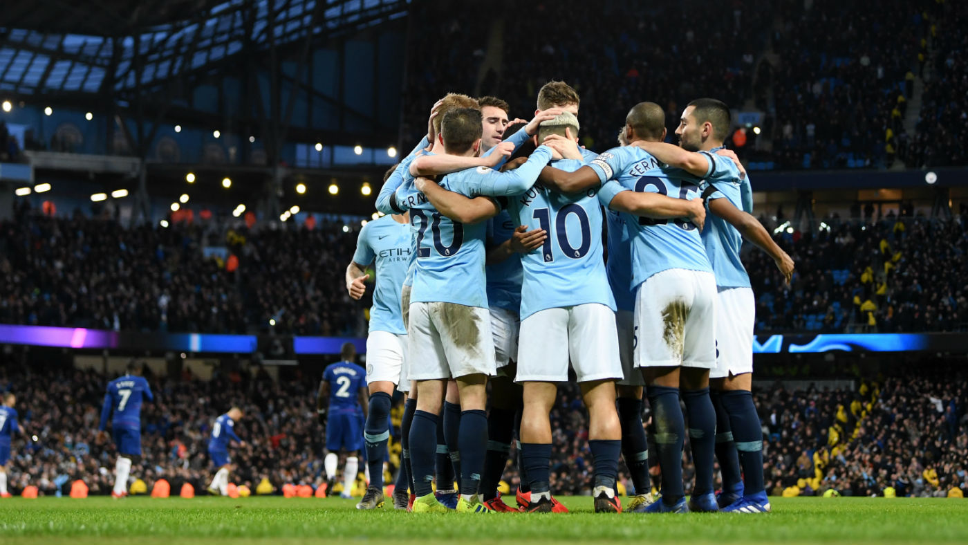 Manchester City players congratulate Sergio Aguero after he scored the team’s fifth against Chelsea