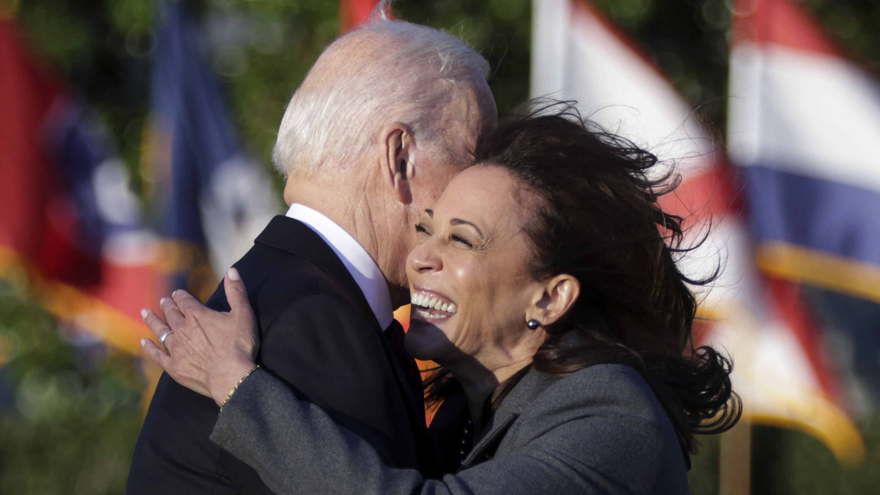 Kamala Harris and Joe Biden hug at White House signing ceremony for $1.2trn infrastructure package
