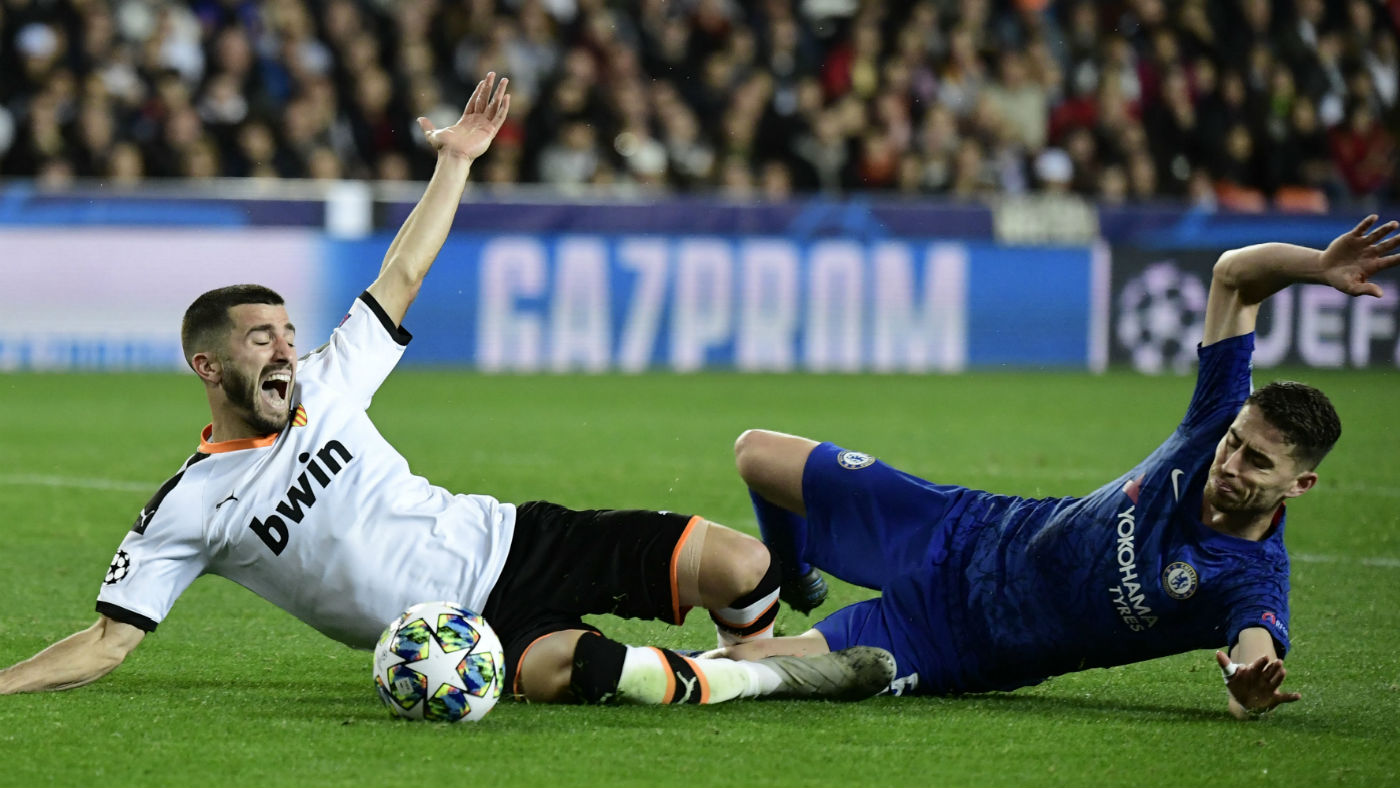 Valencia defender Jose Luis Gaya Pena battles for the ball with Chelsea midfielder Jorginho  