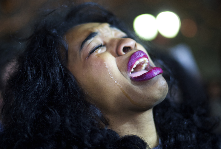 PHILADELPHIA, PA - DECEMBER 3:A demonstrator cries while gathering in Philadelphia to protest the Eric Garner grand jury decision during a Christmas Tree lighting ceremony at City Hall Decemb