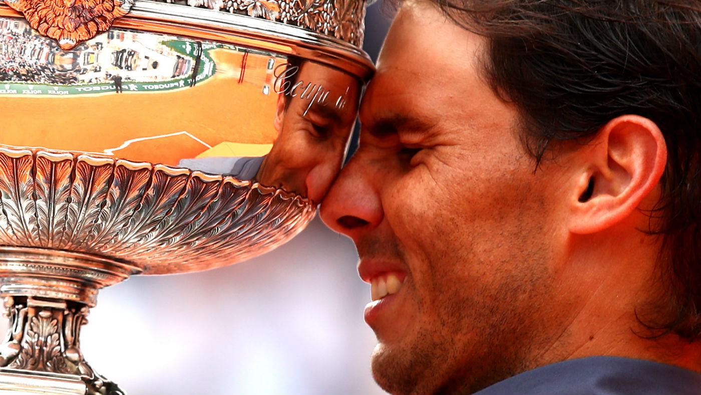 Spaniard Rafael Nadal celebrates with the trophy following his win at the 2019 French Open