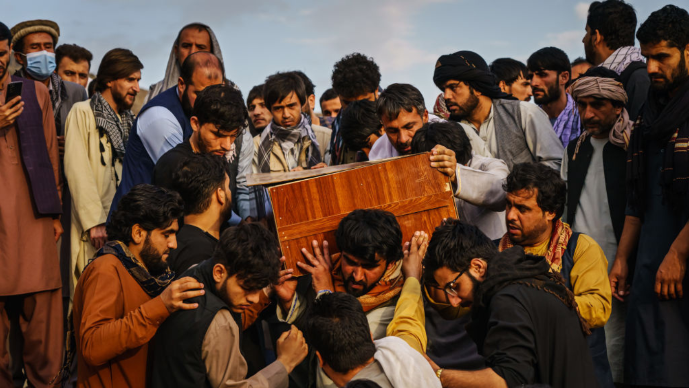 People hold the coffin of an Afghan civilian killed in a US air strike 