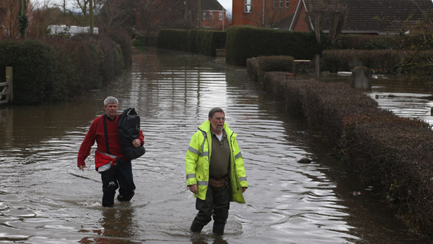  In February this year people walked in flood water in Moorland on the Somerset Levels 