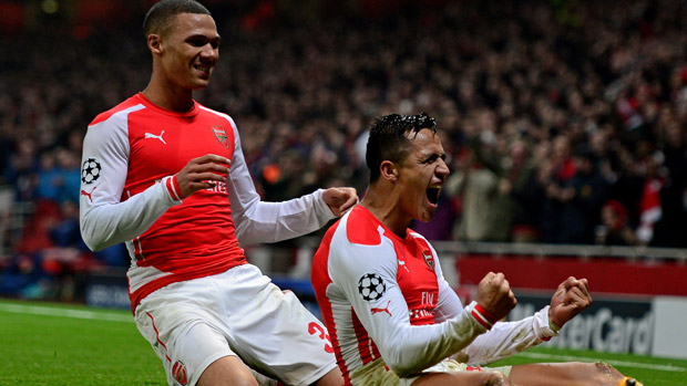 Alexis Sanchez and Kieran Gibbs of Arsenal celebrate after scoring during the match between Arsenal and Borussia Dortmund