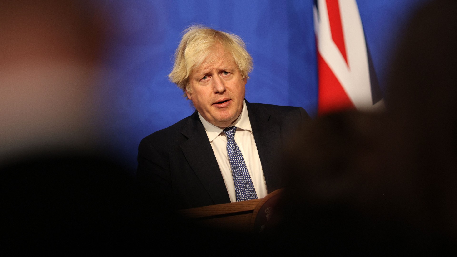 Boris Johnson announces new measures to slow the spread of Omicron 