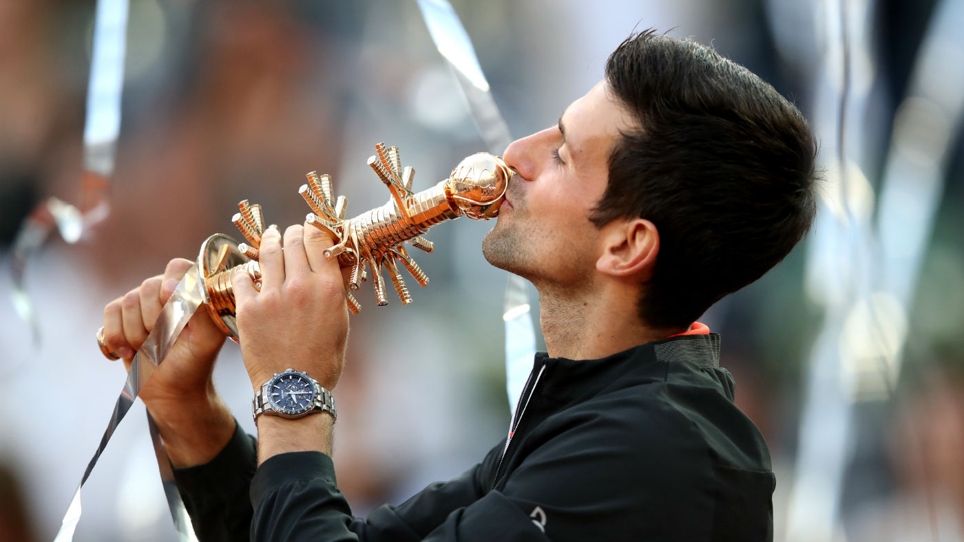 Novak Djokovic kisses the trophy after beating Stefano Tsitsipas in the Madrid Open final